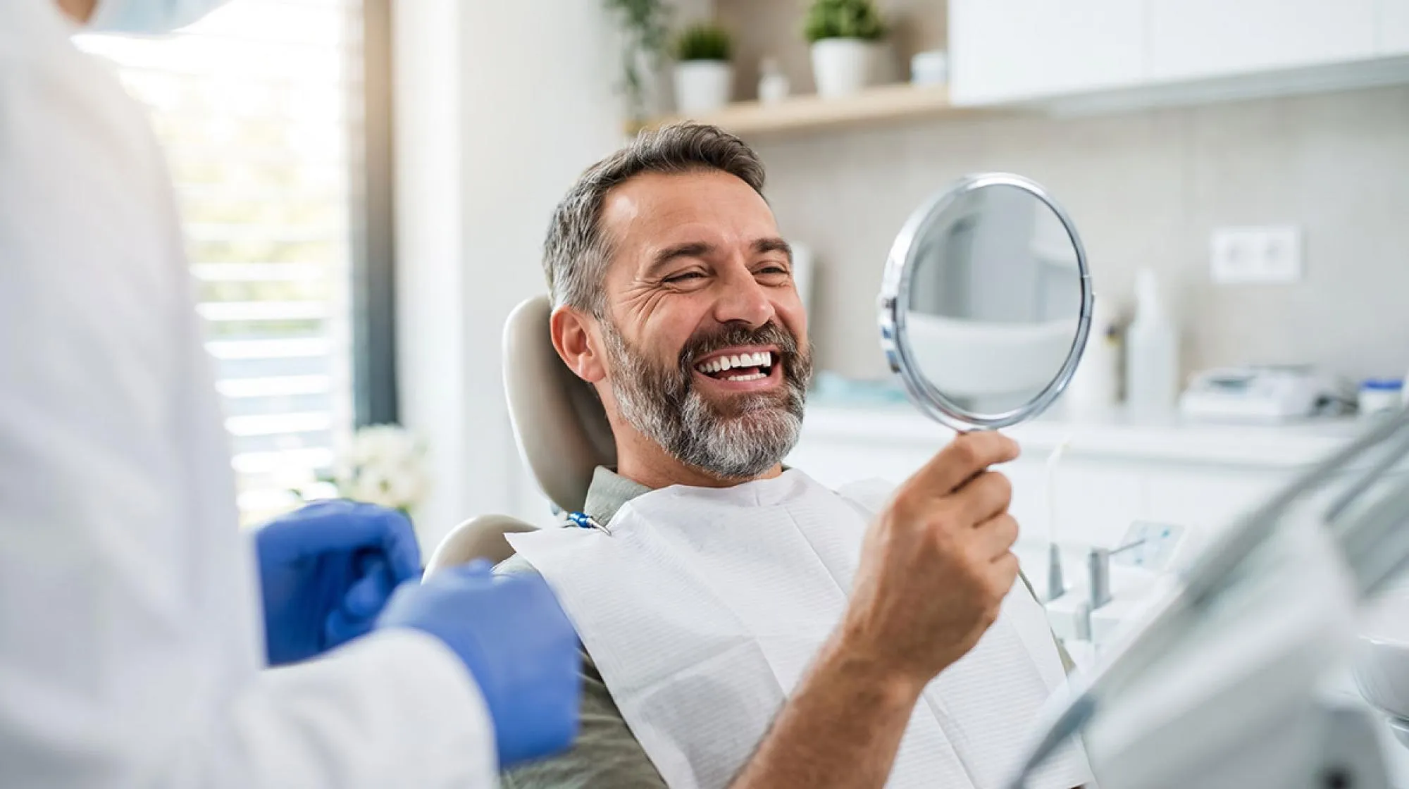 Male dental patient happy with his dental bonding 