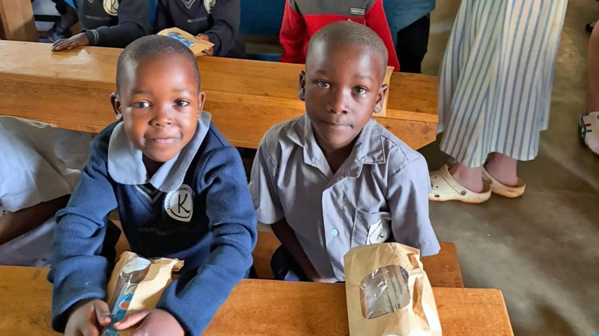 School children in Uganda receiving dental care packages.