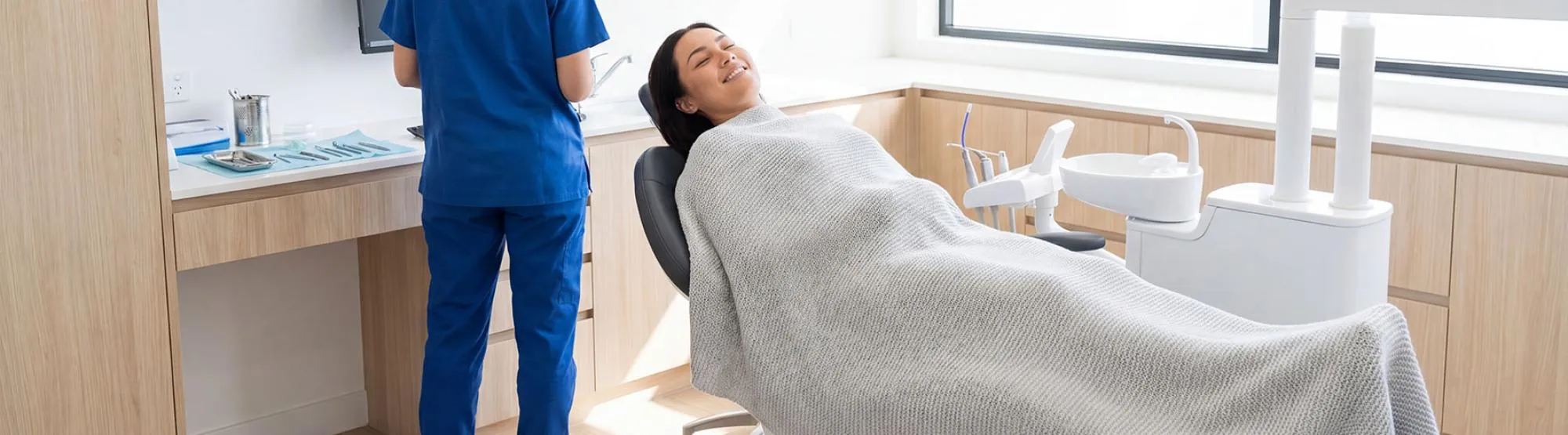 A patient relaxing comfortably in a modern, bright AltaVia Dental treatment room